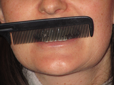 Apraxia brush teeth with comb